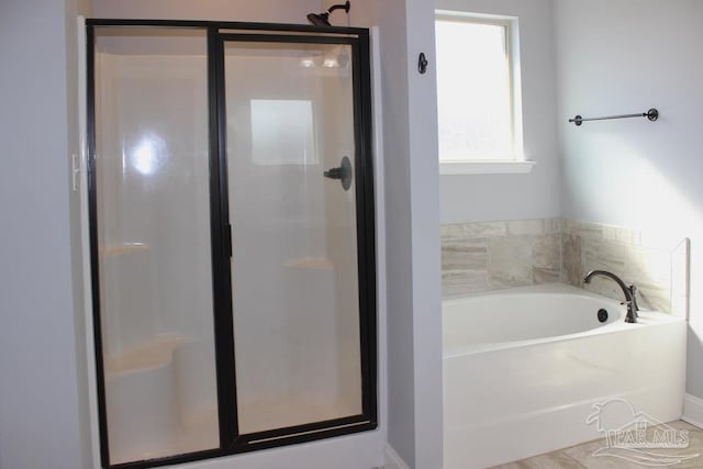 bathroom featuring plus walk in shower