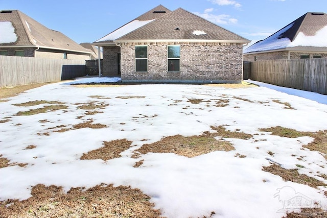 view of snow covered property