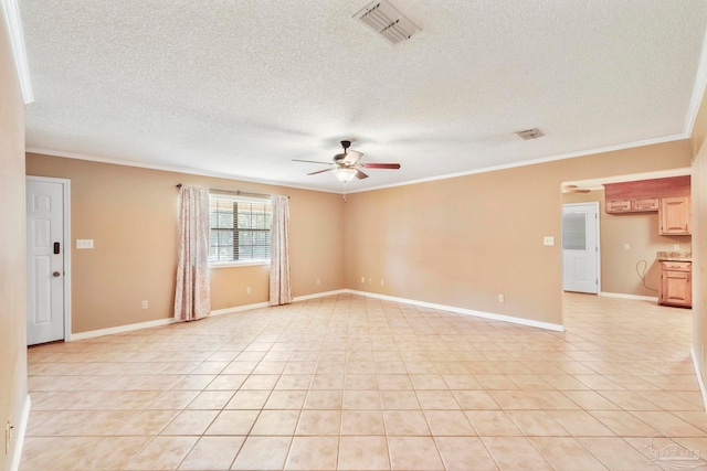 tiled empty room featuring a textured ceiling, ceiling fan, and ornamental molding