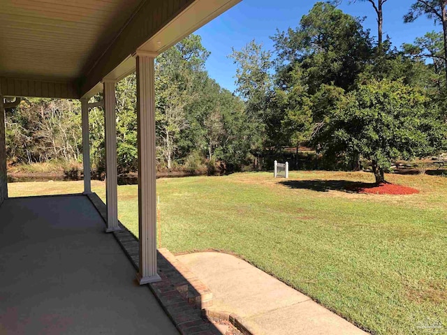 view of yard with covered porch