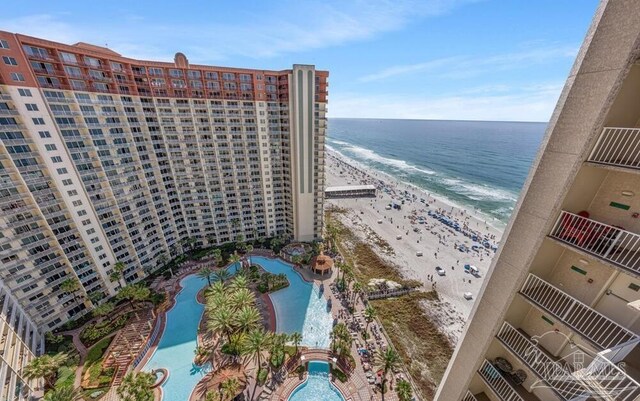 drone / aerial view with a beach view and a water view