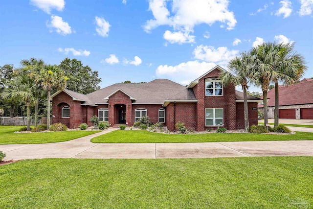 2882 Tunnel Rd, Pace, FL 32571 - view of front of property featuring a front yard, brick siding, and a shingled roof