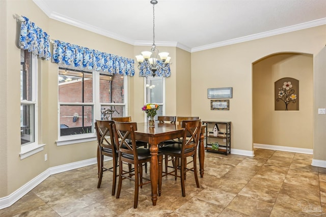 2882 Tunnel Rd, Pace, FL 32571 - dining area featuring ornamental molding, arched walkways, and a chandelier