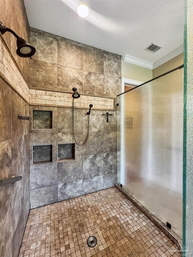 2882 Tunnel Rd, Pace, FL 32571 - full bath with tiled shower, crown molding, and a textured ceiling