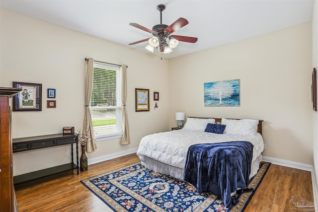 2882 Tunnel Rd, Pace, FL 32571 - bedroom with wood finished floors and a ceiling fan