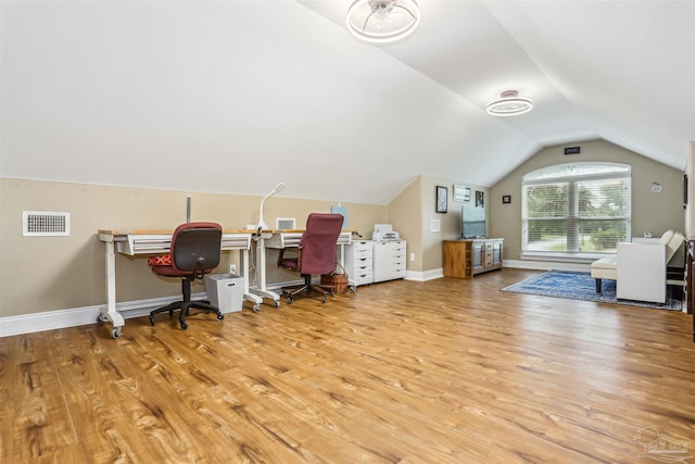 2882 Tunnel Rd, Pace, FL 32571 - office area featuring wood finished floors and vaulted ceiling