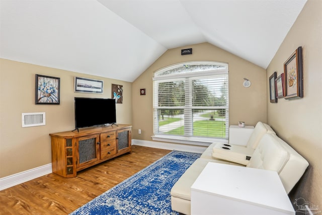 2882 Tunnel Rd, Pace, FL 32571 - living room featuring light wood finished floors and lofted ceiling