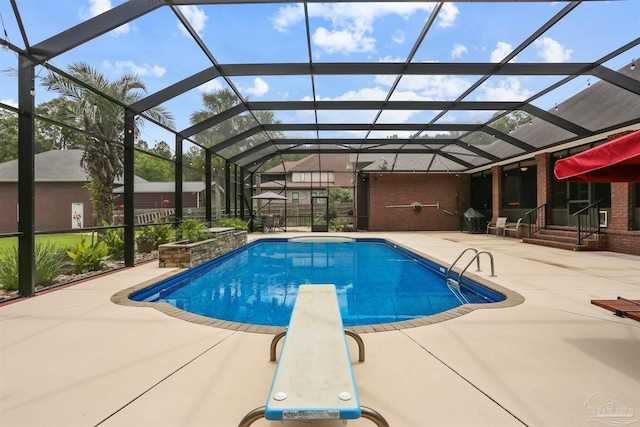 2882 Tunnel Rd, Pace, FL 32571 - outdoor pool with a patio, a diving board, and glass enclosure