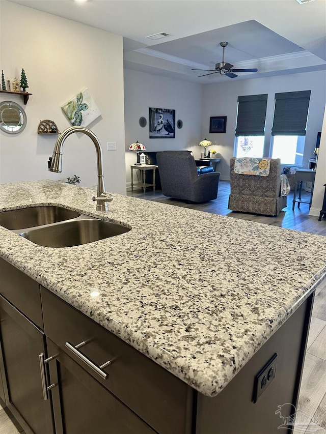 2656 Avalon St, Cantonment, FL 32533 - kitchen featuring ceiling fan, light stone countertops, a sink, open floor plan, and light wood-type flooring