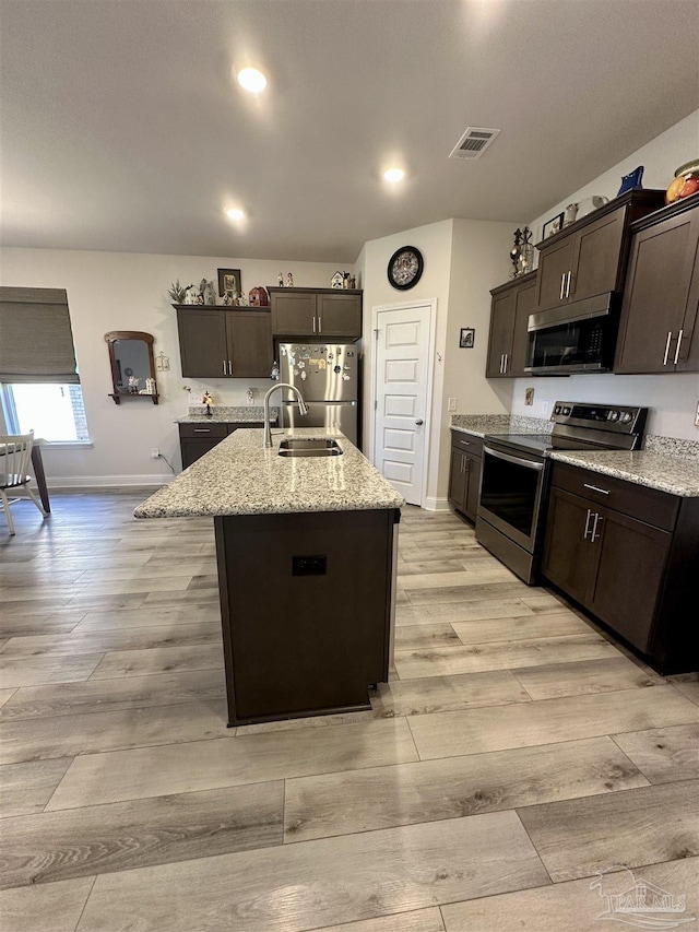 2656 Avalon St, Cantonment, FL 32533 - kitchen featuring a sink, appliances with stainless steel finishes, light wood-style flooring, and visible vents