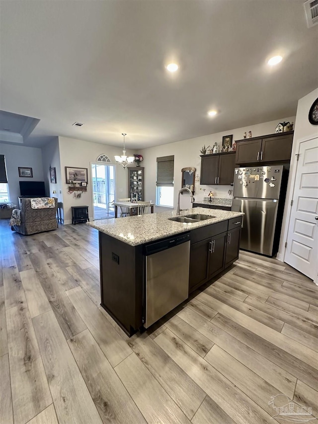 2656 Avalon St, Cantonment, FL 32533 - kitchen with a sink, open floor plan, an inviting chandelier, stainless steel appliances, and an island with sink