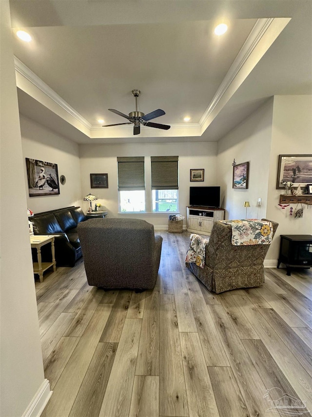 2656 Avalon St, Cantonment, FL 32533 - living area featuring crown molding, a raised ceiling, a ceiling fan, and wood finished floors