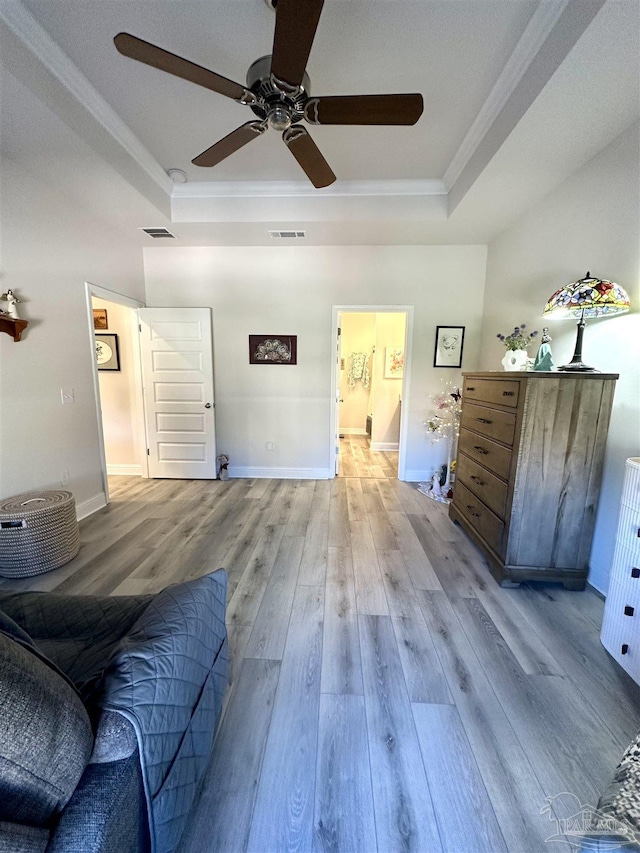 2656 Avalon St, Cantonment, FL 32533 - living room featuring visible vents, ornamental molding, a raised ceiling, and ceiling fan