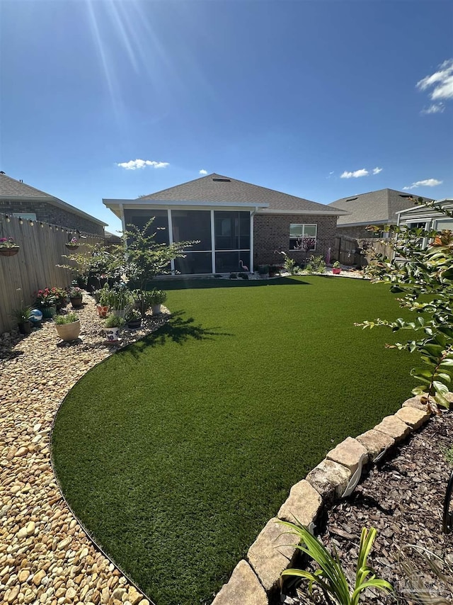 2656 Avalon St, Cantonment, FL 32533 - view of yard with a sunroom and a fenced backyard