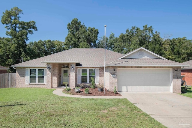 single story home featuring a garage and a front lawn