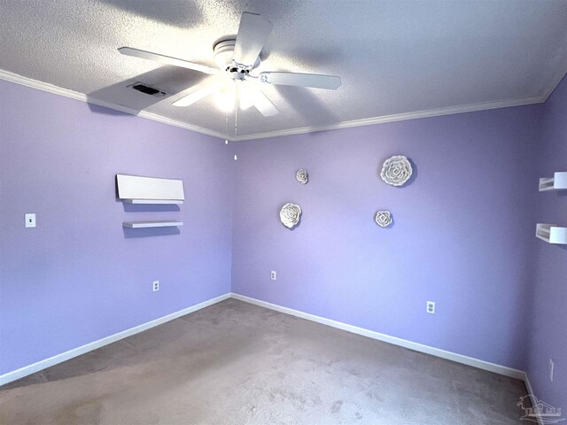 carpeted empty room featuring a textured ceiling, ceiling fan, and crown molding