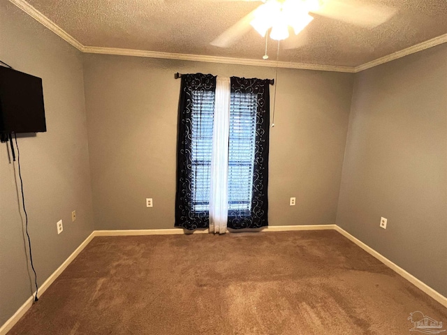 carpeted empty room featuring a textured ceiling, ceiling fan, and crown molding