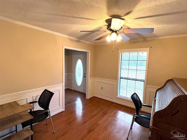 office space with hardwood / wood-style floors, a textured ceiling, ceiling fan, and crown molding