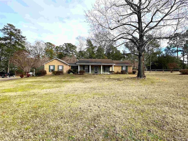 ranch-style home with a front lawn