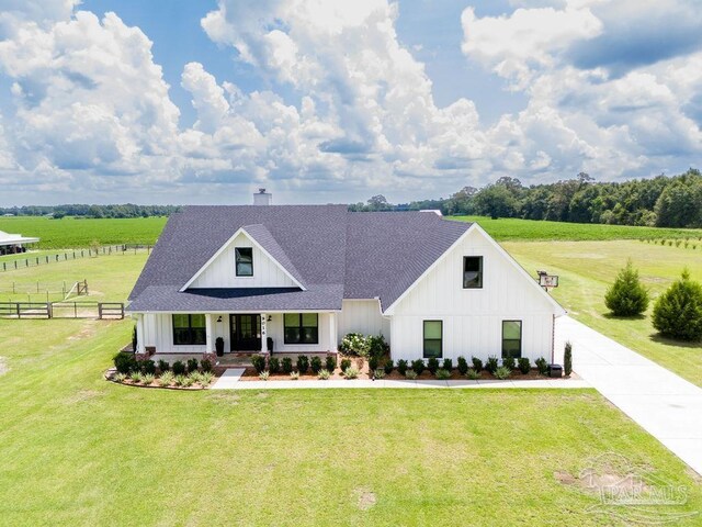 modern farmhouse with a front lawn