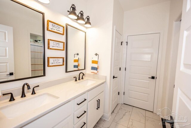 bathroom featuring tile patterned flooring and double sink vanity