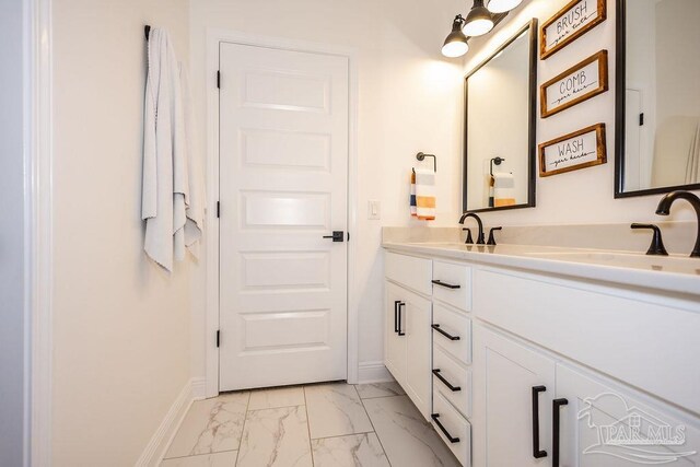 bathroom featuring dual vanity and tile patterned floors