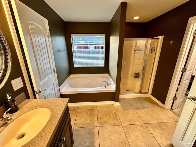2924 Sundance Ln, Cantonment, FL 32533 - bathroom featuring vanity, a bath, a stall shower, and tile patterned flooring