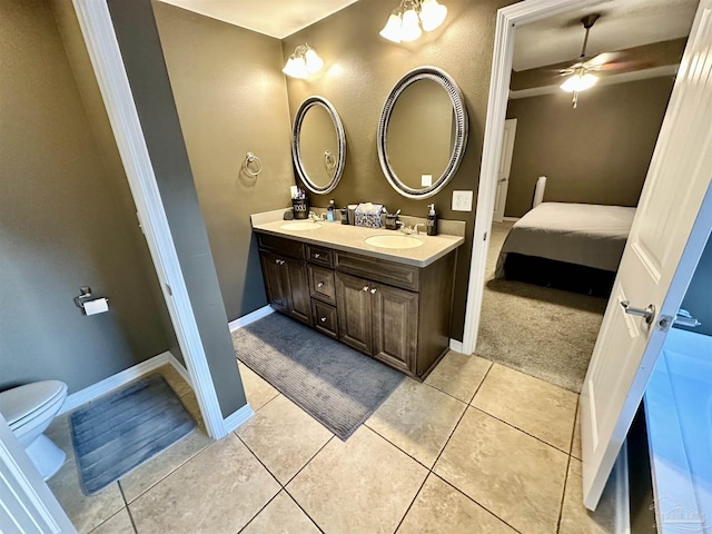 2924 Sundance Ln, Cantonment, FL 32533 - ensuite bathroom featuring double vanity, ceiling fan, and tile patterned floors