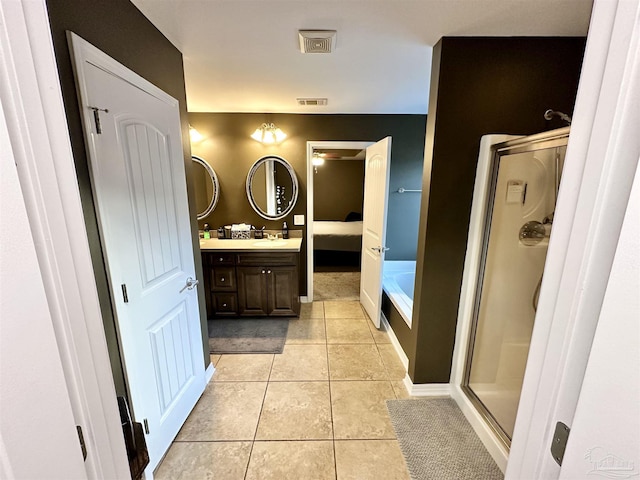 2924 Sundance Ln, Cantonment, FL 32533 - bathroom featuring vanity, a garden tub, tile patterned flooring, and a stall shower