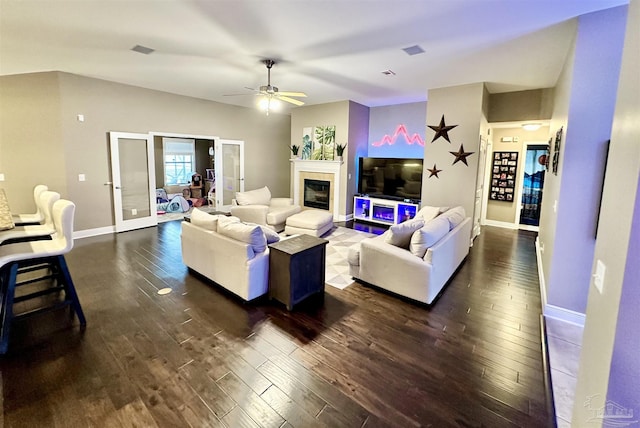 2924 Sundance Ln, Cantonment, FL 32533 - living room featuring dark wood-type flooring, ceiling fan, and a tile fireplace