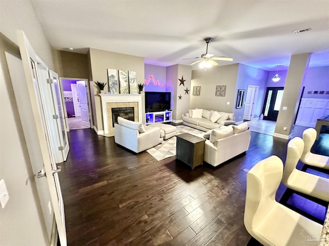 2924 Sundance Ln, Cantonment, FL 32533 - living room featuring dark wood-style floors, a ceiling fan, and a fireplace