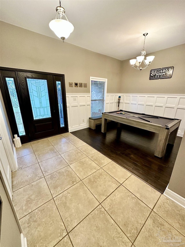 2924 Sundance Ln, Cantonment, FL 32533 - tiled foyer featuring a chandelier, billiards table, and a decorative wall