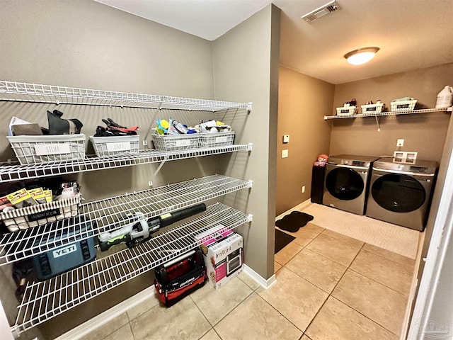 2924 Sundance Ln, Cantonment, FL 32533 - laundry room with tile patterned flooring and separate washer and dryer