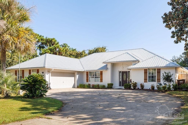 ranch-style house featuring a garage