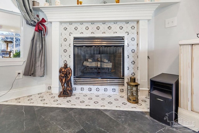 interior details with a tile fireplace