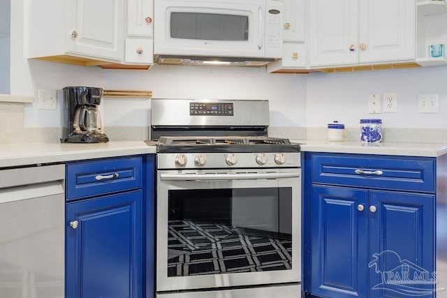 kitchen featuring white cabinets, stainless steel range with gas cooktop, and blue cabinetry