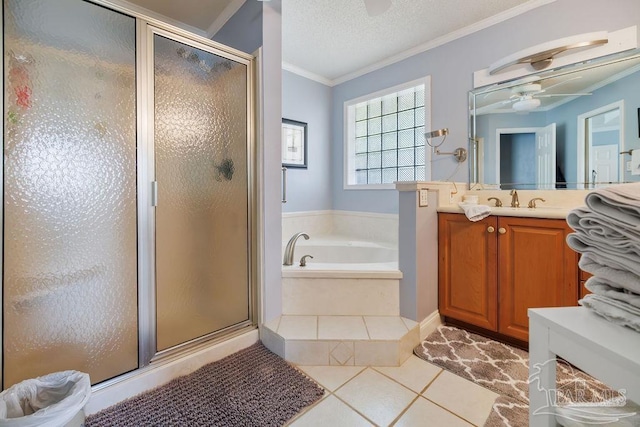 bathroom with vanity, tile patterned floors, crown molding, ceiling fan, and separate shower and tub