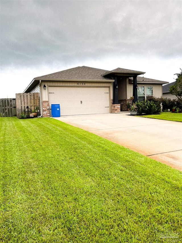 6135 Redberry Dr, Gulf Breeze, FL 32563 - view of front of property featuring a garage, driveway, brick siding, and board and batten siding