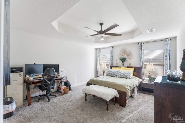 6135 Redberry Dr, Gulf Breeze, FL 32563 - carpeted bedroom featuring an office area, a raised ceiling, and ceiling fan