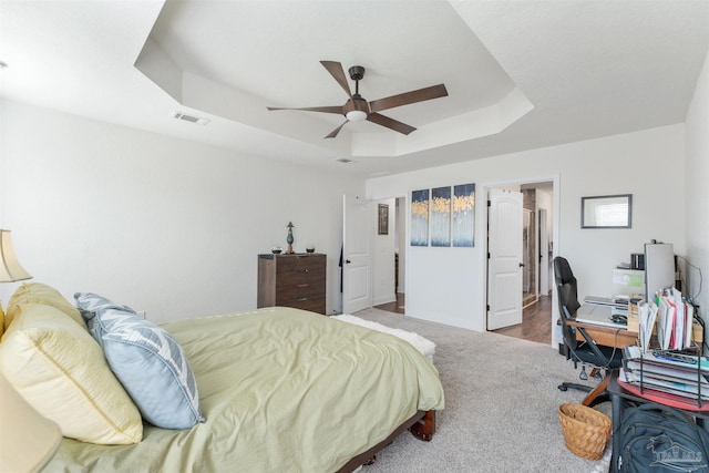 6135 Redberry Dr, Gulf Breeze, FL 32563 - bedroom with a raised ceiling, carpet floors, an office area, and a ceiling fan