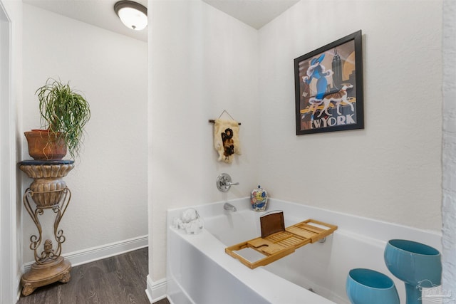 6135 Redberry Dr, Gulf Breeze, FL 32563 - full bathroom featuring a bath and wood finished floors