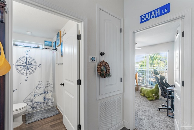 6135 Redberry Dr, Gulf Breeze, FL 32563 - bathroom with toilet and wood finished floors