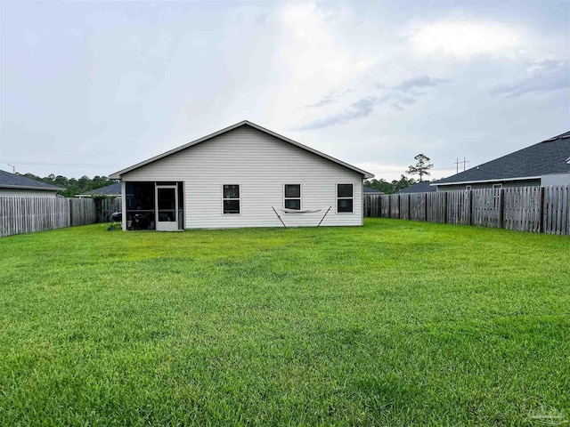 6135 Redberry Dr, Gulf Breeze, FL 32563 - back of property featuring a fenced backyard and a sunroom
