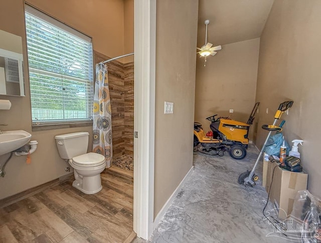 9873 Chumuckla Springs Rd, Jay, FL 32565 - bathroom featuring baseboards, ceiling fan, a stall shower, and toilet