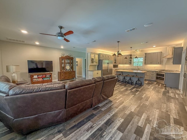 9873 Chumuckla Springs Rd, Jay, FL 32565 - living area featuring a ceiling fan, visible vents, wood finished floors, and recessed lighting