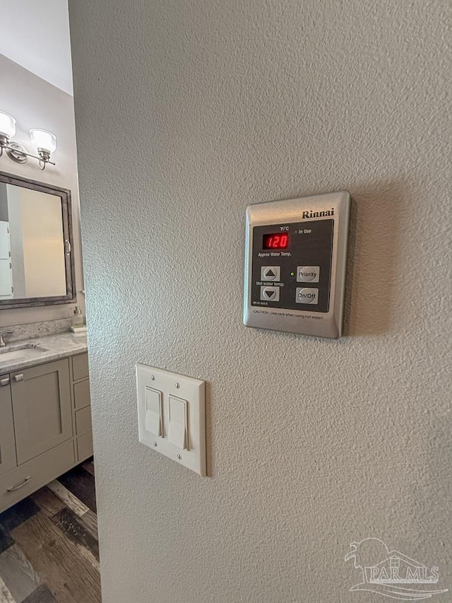 9873 Chumuckla Springs Rd, Jay, FL 32565 - details with a sink and wood finished floors