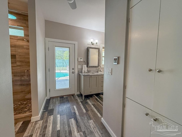 9873 Chumuckla Springs Rd, Jay, FL 32565 - entryway featuring baseboards, a sink, and dark wood-style flooring