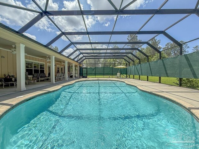 9873 Chumuckla Springs Rd, Jay, FL 32565 - view of pool with an outdoor hangout area, a fenced in pool, a ceiling fan, a patio, and glass enclosure