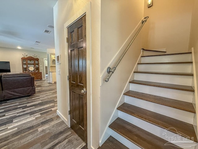 9873 Chumuckla Springs Rd, Jay, FL 32565 - stairway featuring baseboards, visible vents, and wood finished floors