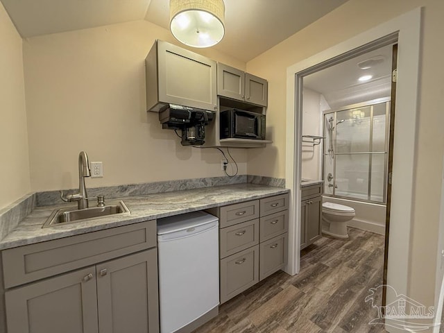 9873 Chumuckla Springs Rd, Jay, FL 32565 - kitchen with dark wood-style flooring, black microwave, fridge, a sink, and gray cabinetry